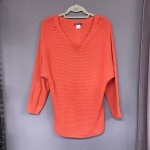 Venus sweater with button down back.  Size M